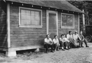 Pictured in front of a cabin at Trout Lake are C. Juday, Eleanor Tressler, Fred Stare, Lowell Taylor, Ed Schneberger, E.A. Birge and Hugo Baum