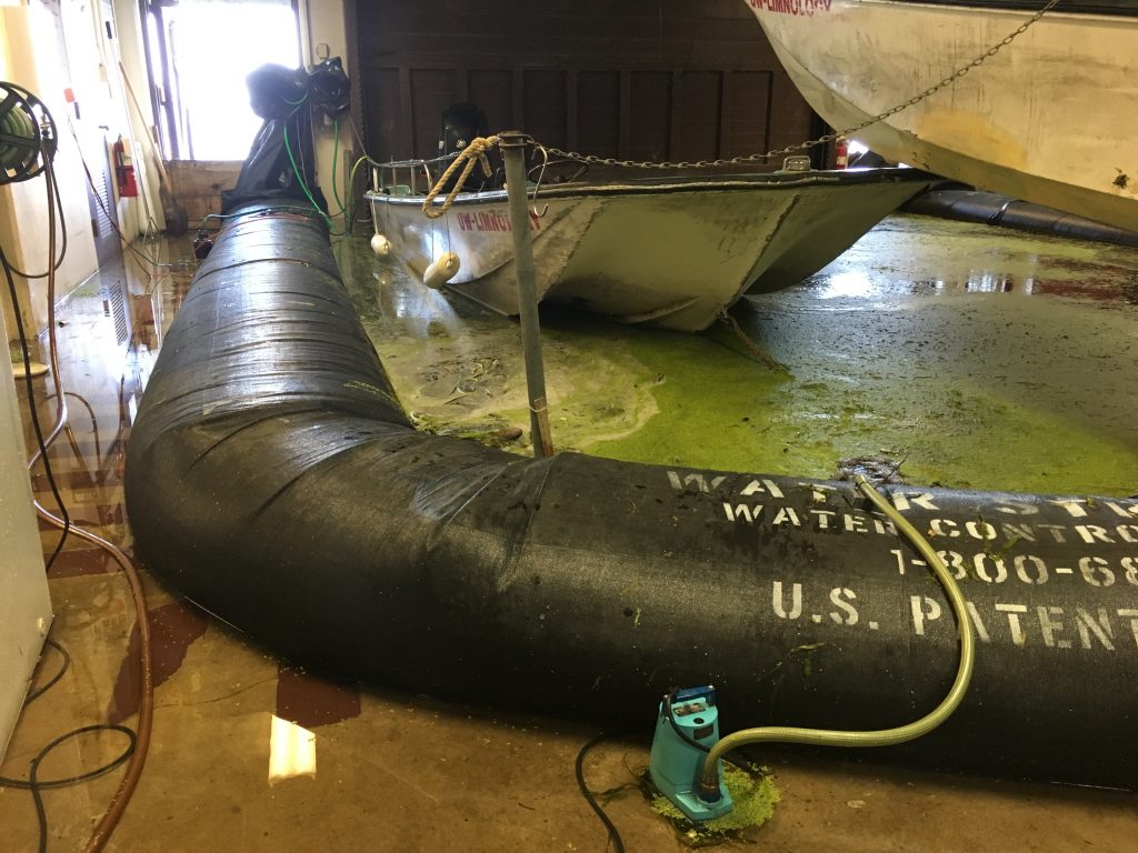 The high water overflowed the Hasler Lab boat slip making our inflatable dyke and water pumps essential for much of the fall. Photo: Adam Hinterthuer