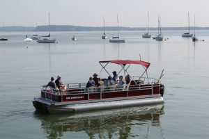 Group of CFLer's out on first pontoon boat on Lake Mendota