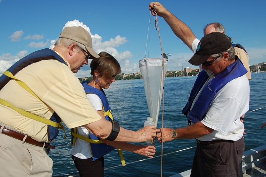 Dave Harring shows attendees at Hasler Lab Open House, 2014 how to use zooplankton net. Over five decades, the Limnos took hundreds, if not thousands, of people out on Lake Mendota. Dave was there for two of those decades.