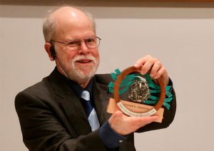 Steve Carpenter holding the Ramon Margalef Prize in Ecology for photo