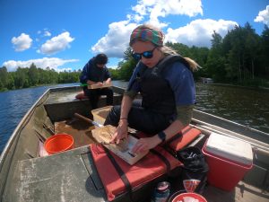 Undergrads Olivia Nyffeler and Kailee Berge sampling fish on McDermott Lake. Photo: Cassie Gauthier
